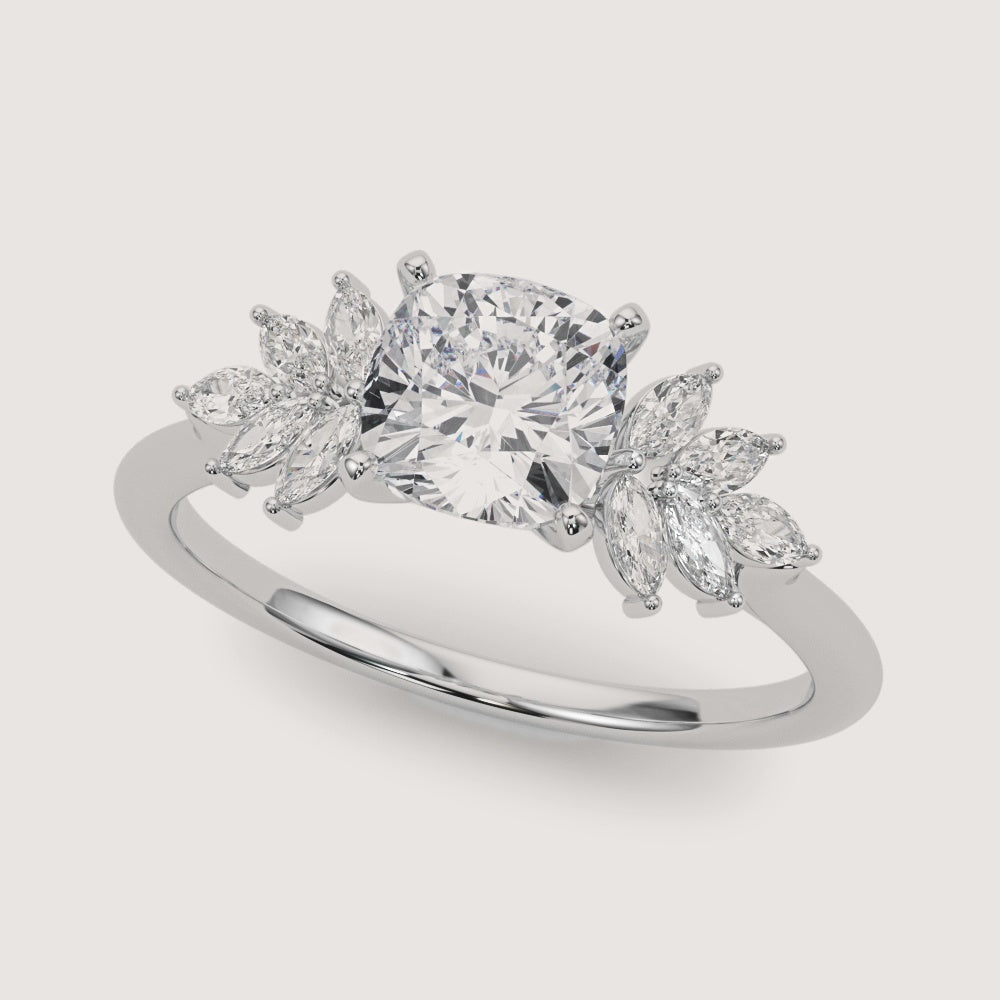 cushion-cut-diamond-nature-inspired-marquise-side-stone-engagement-ring-white-gold-angle.jpg