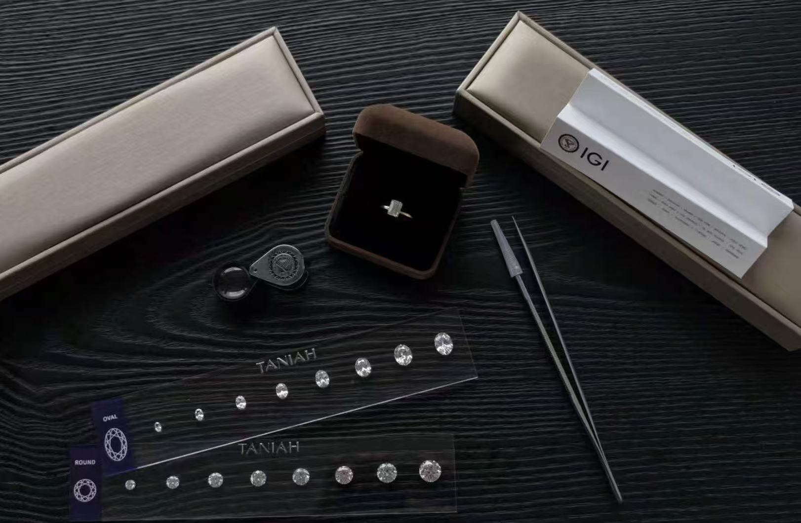 Taniah custom ring consultation with diamond samples, a ring box and an IGI certificate